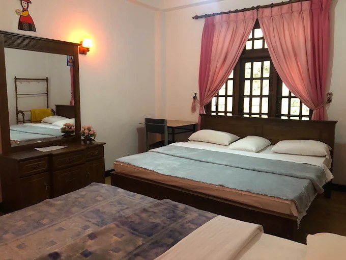 King Bed Room with mountain-view window at Pro Max Villa
